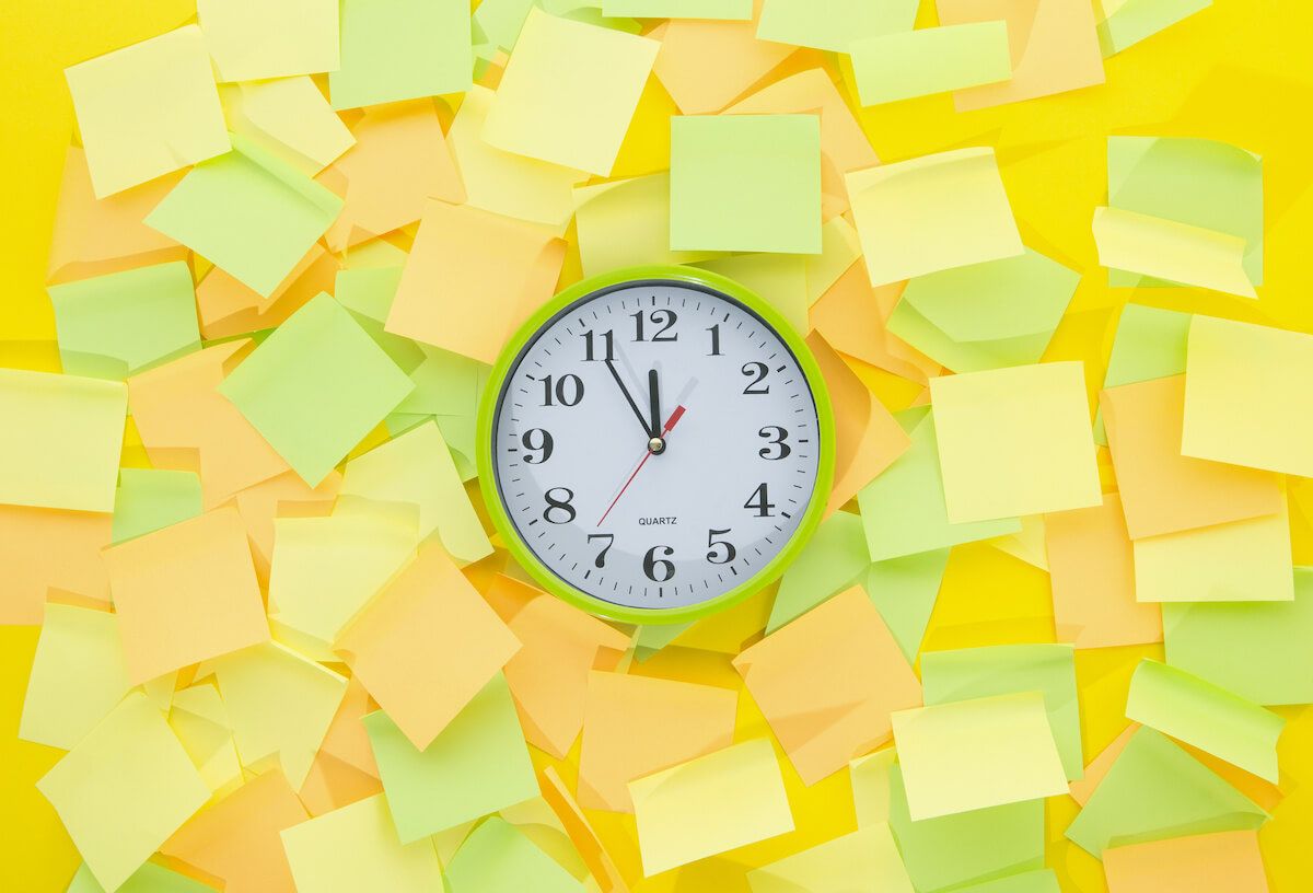 Clock with sticky notes on the background