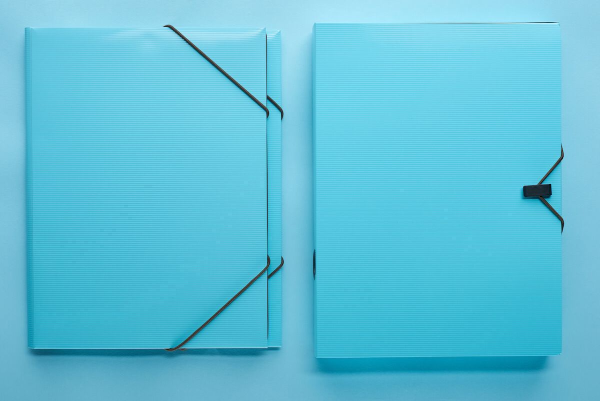 Front and back view of a blue binder