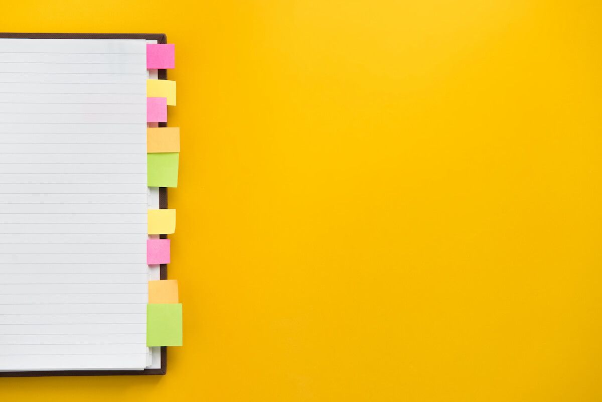 Colorful page markers on a notebook