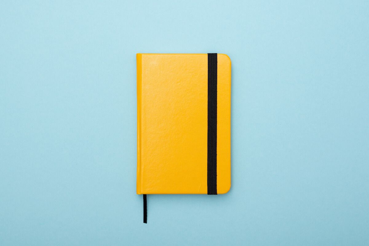 Yellow notebook on a blue background