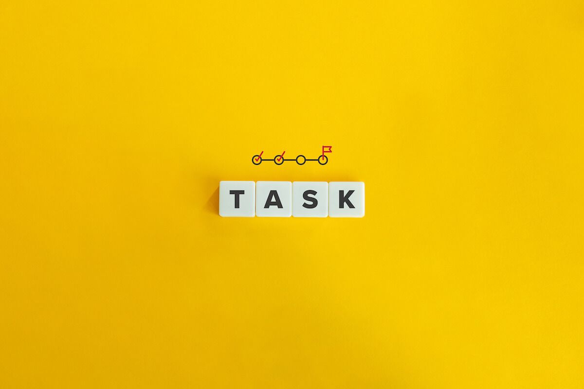 TASK spelled using letter tiles