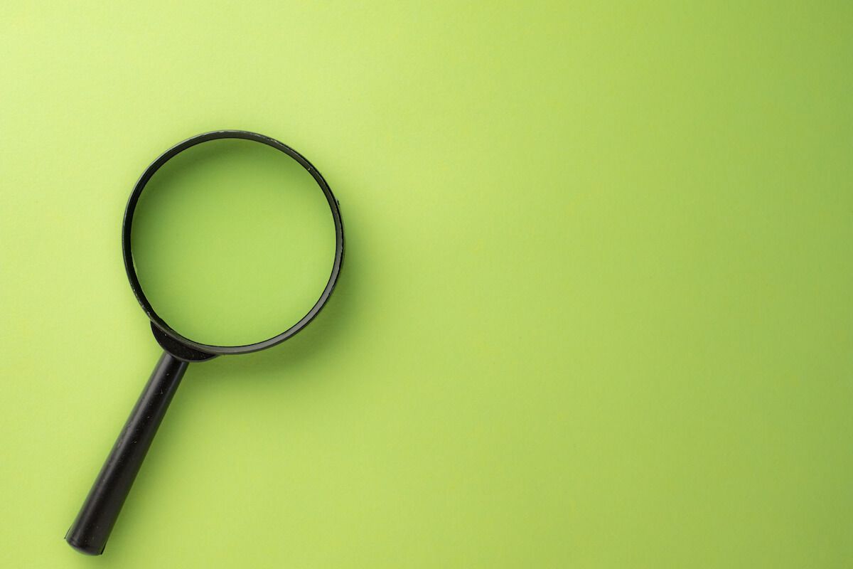 How to focus on studying: magnifying glass on a green background