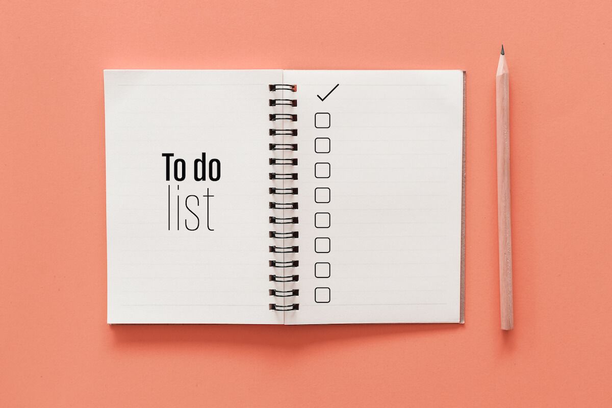 Work smarter not harder: To do list notebook and a pencil